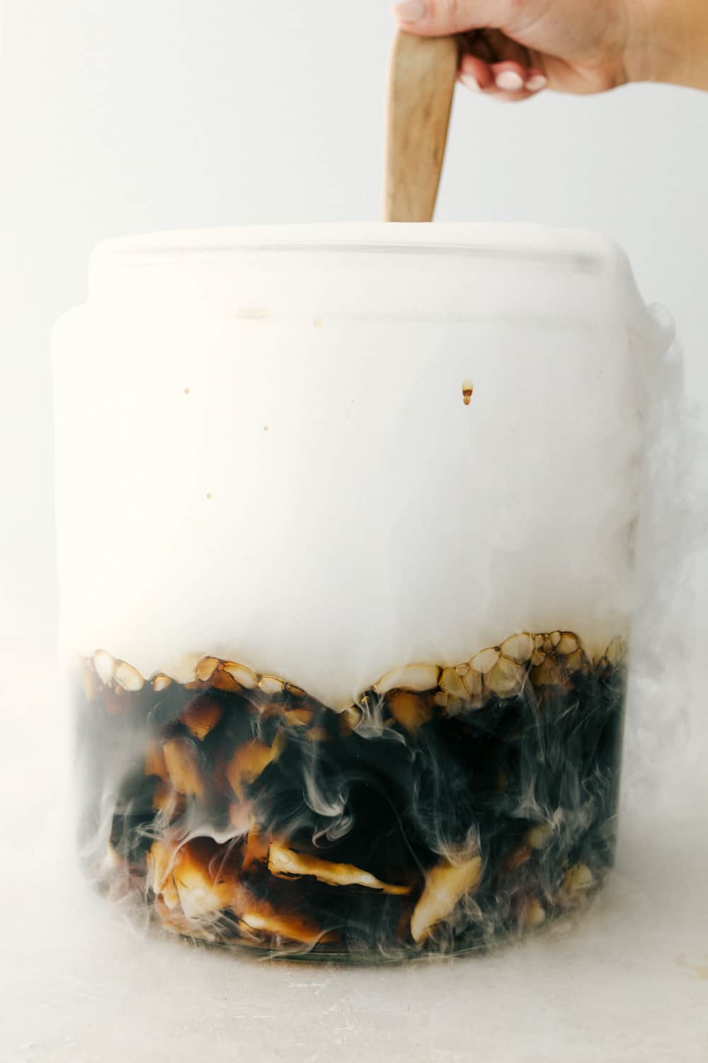 This Homemade Root Beer is a fun, sweet, refreshing treat to make any occasion extra special. It takes just 4 ingredients to create a little magic and a whole lot of tasty fun! ย Adding the dry ice and stirring the Root Beer.