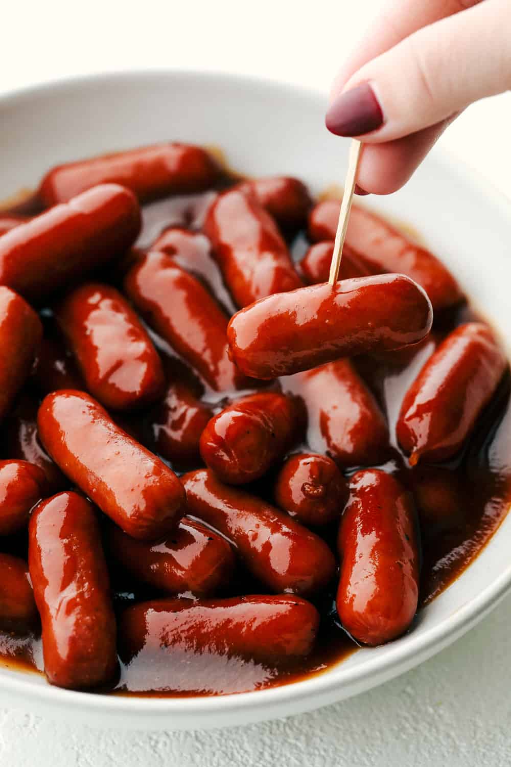 Little Smokies, smothered in a sweet tangy BBQ sauce are one of the easiest, most loved appetizers out there. These are guaranteed to disappear whether it's for a party or dinner, these are just too tasty and fun not to eat. Rich, savory and flavorful Little Smokies.