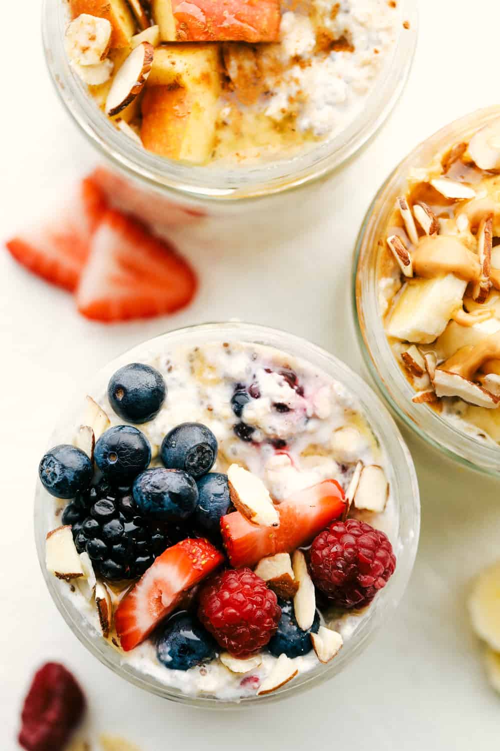 Overnight Oats are a healthy, versatile, make ahead, portable filling breakfast to get you on your way. These oats have to be one of the best inventions EVER! Overnight oats with berries, apples and bananas.