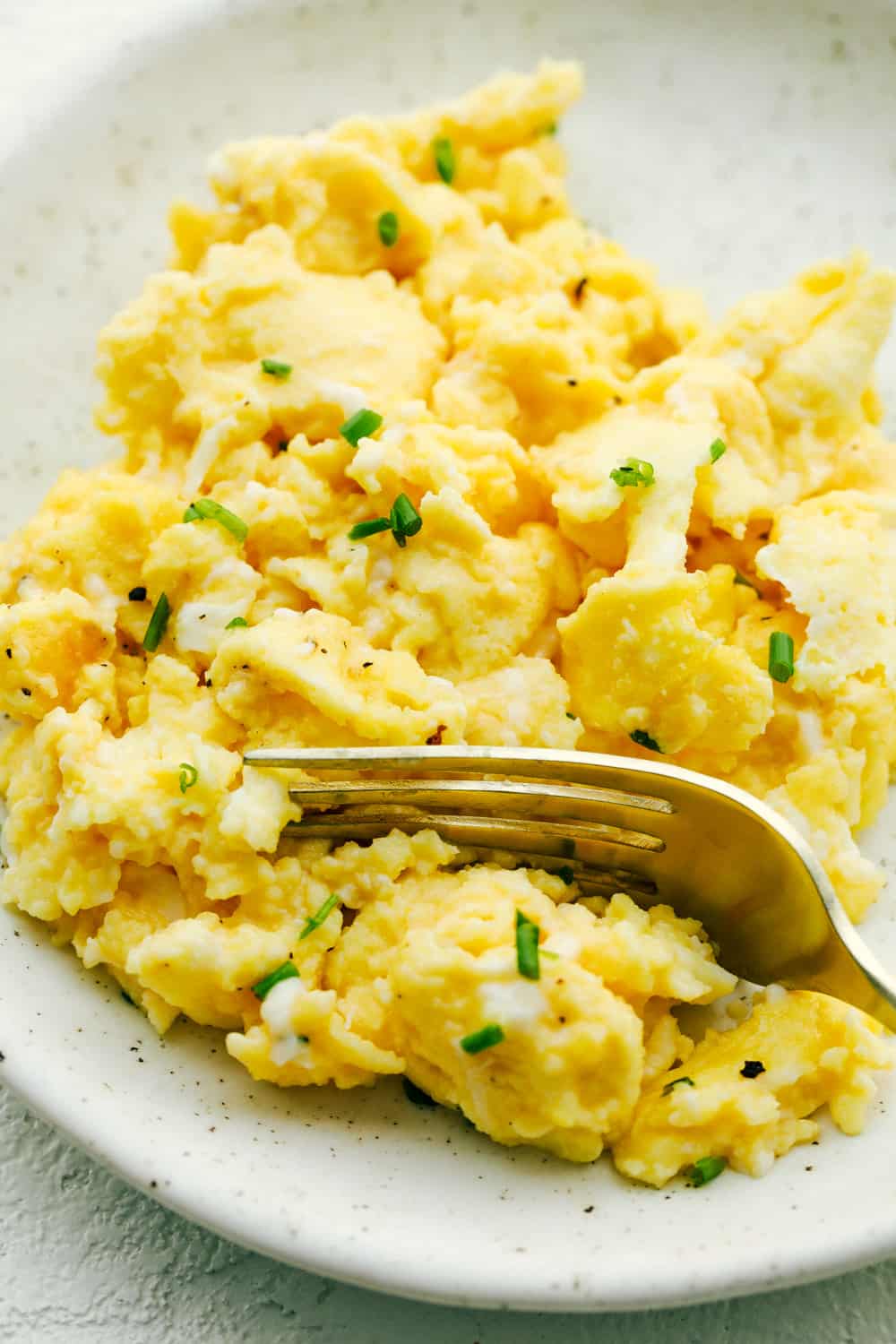 The Best Scrambled Eggs are fluffy, light, moist and taste amazing. There is a secret to it though, and I've got it. The secret to the perfect scrambled eggs is cooking them low and slow! Perfectly soft, fluffy and light scrambled eggs.