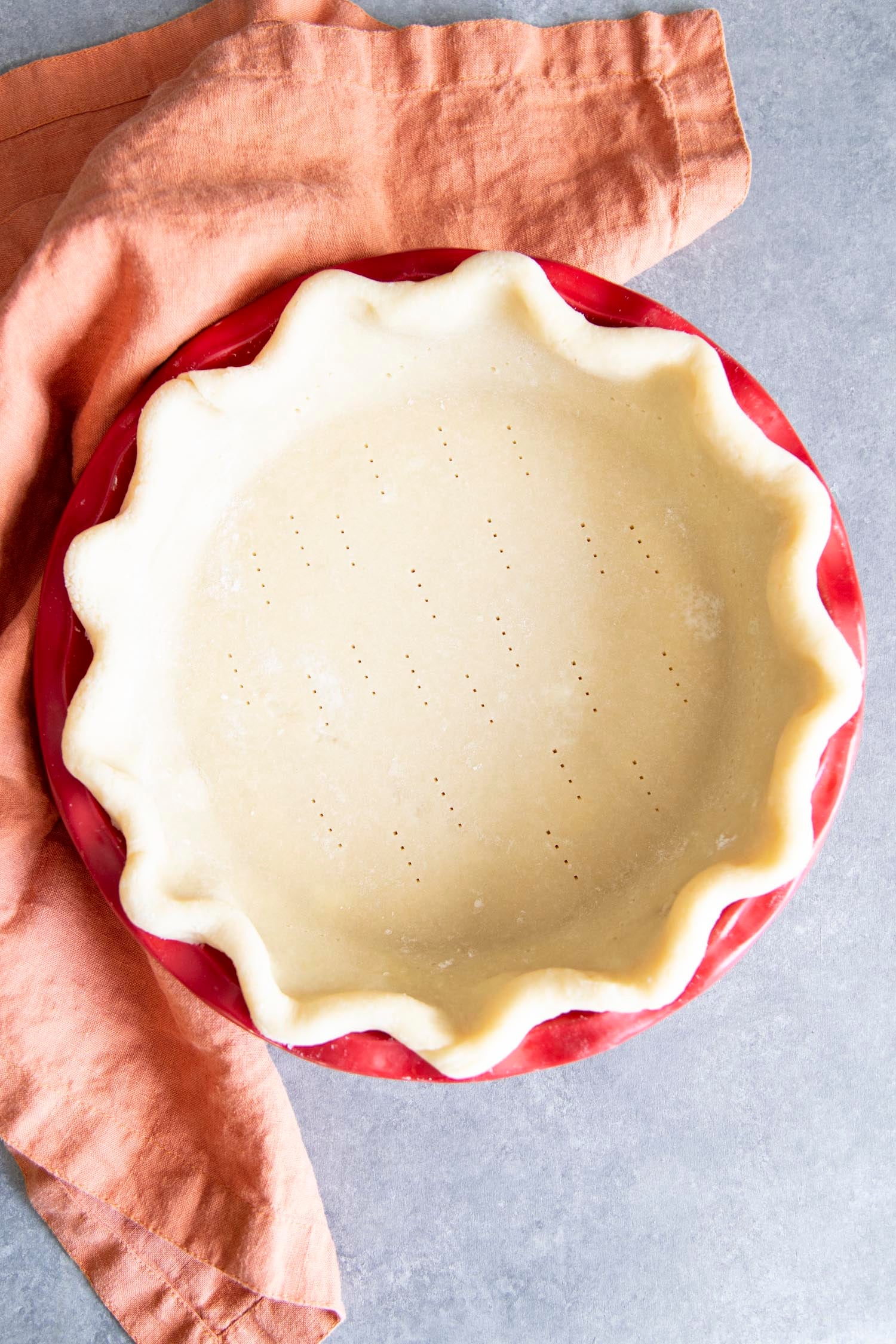 Amazing Decadent Pecan Pie is a rich, chewy, nutty, sweet, traditional holiday staple. For many the holidays aren't the holidays without this brilliant dessert on the table. This homemade delight is surprisingly super simple. You are going to love it! Preparing pie crust.