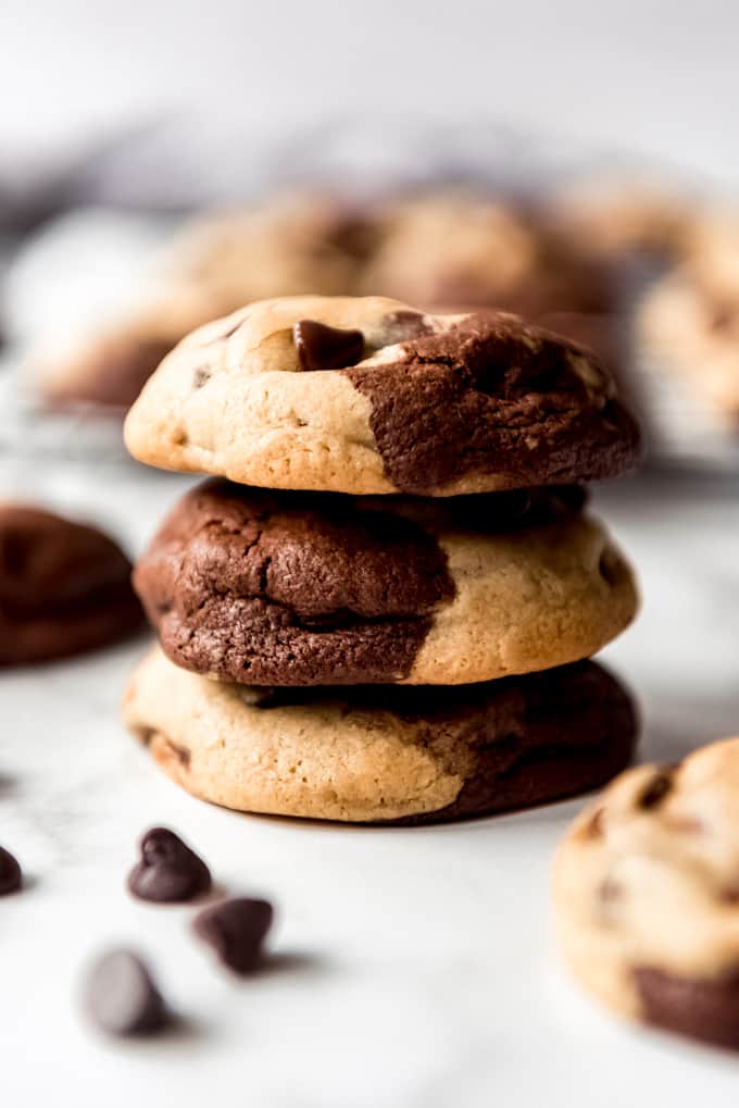 Brookies Cookies are a deliciously fun mashup of two of our favorite desserts: brownies and chocolate chip cookies! Soft and chewy with plenty of chocolate chips, these are always a hit with the family! A stack of three chocolate and chocolate chip cookies.