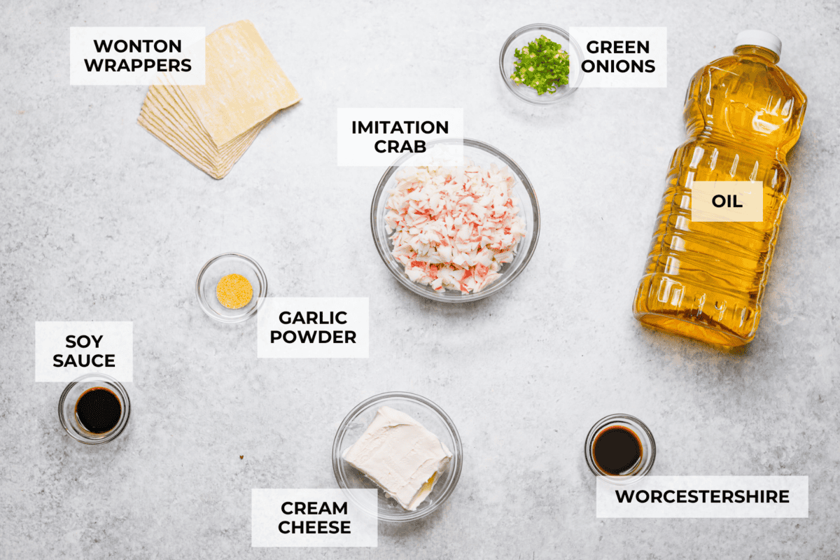 Crab Rangoons are a fun, Asian-inspired appetizer filled with crab meat, smooth cream cheese, and seasoning. Wrapped in a wonton wrapper and deep-fried, they are irresistible! Overhead shot of labeled ingredients.
