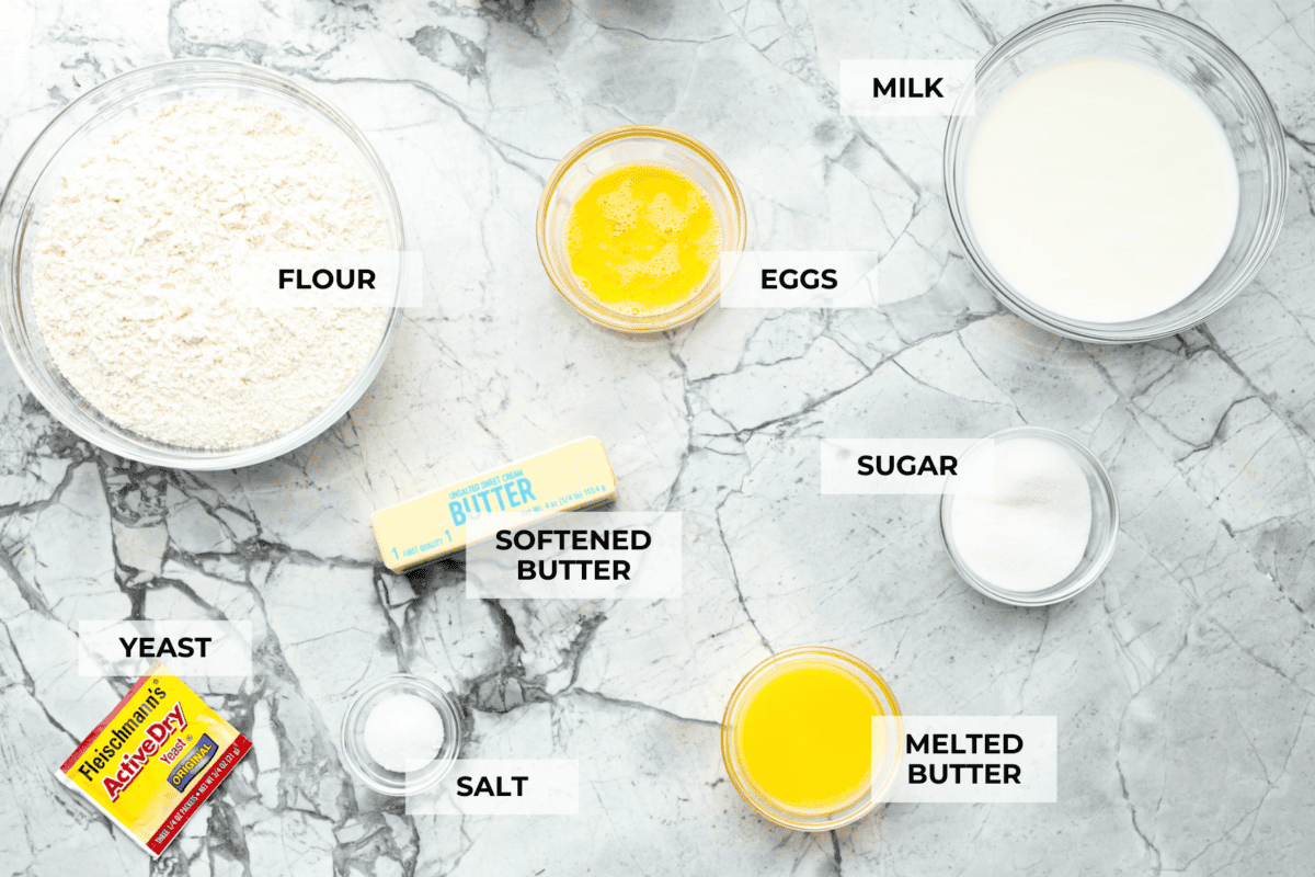Lion House Rolls are the best dinner rolls for holiday meals or any occasion. These buttery, super-soft rolls are the perfect vehicle for soaking up delicious soups, sauces, and gravies. Overhead shot of labeled ingredients.