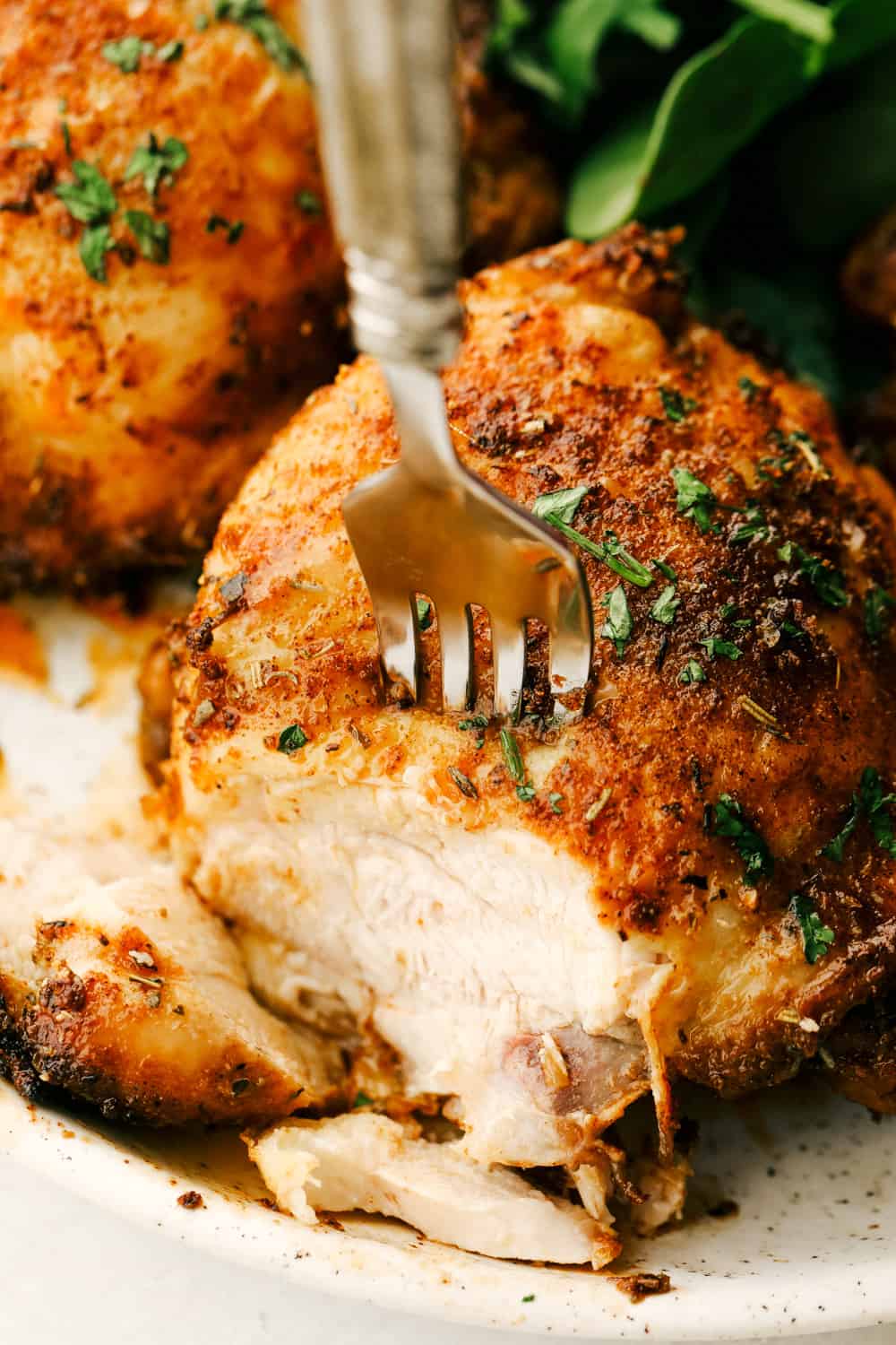 Crispy and Juicy Air Fryer Chicken Thighs are the perfect thing to make tonight! Perfectly seasoned, these are the most scrumptious chicken thighs EVER! Fork tender juicy air fryer chicken thighs.