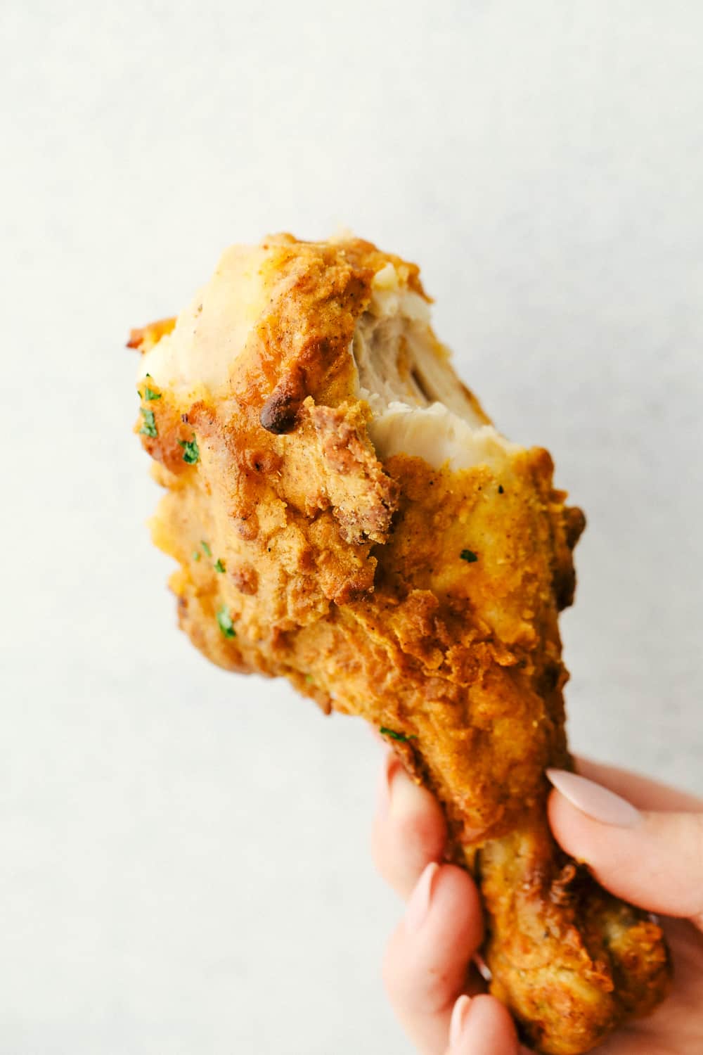 Crispy Air Fryer "Fried" Chicken is what Air Fryers were created to do! Crunchy golden seasoned outside, and tender, juicy, full of flavor inside! This is how chicken was meant to be eaten. Crispy air fryer fried chicken leg.