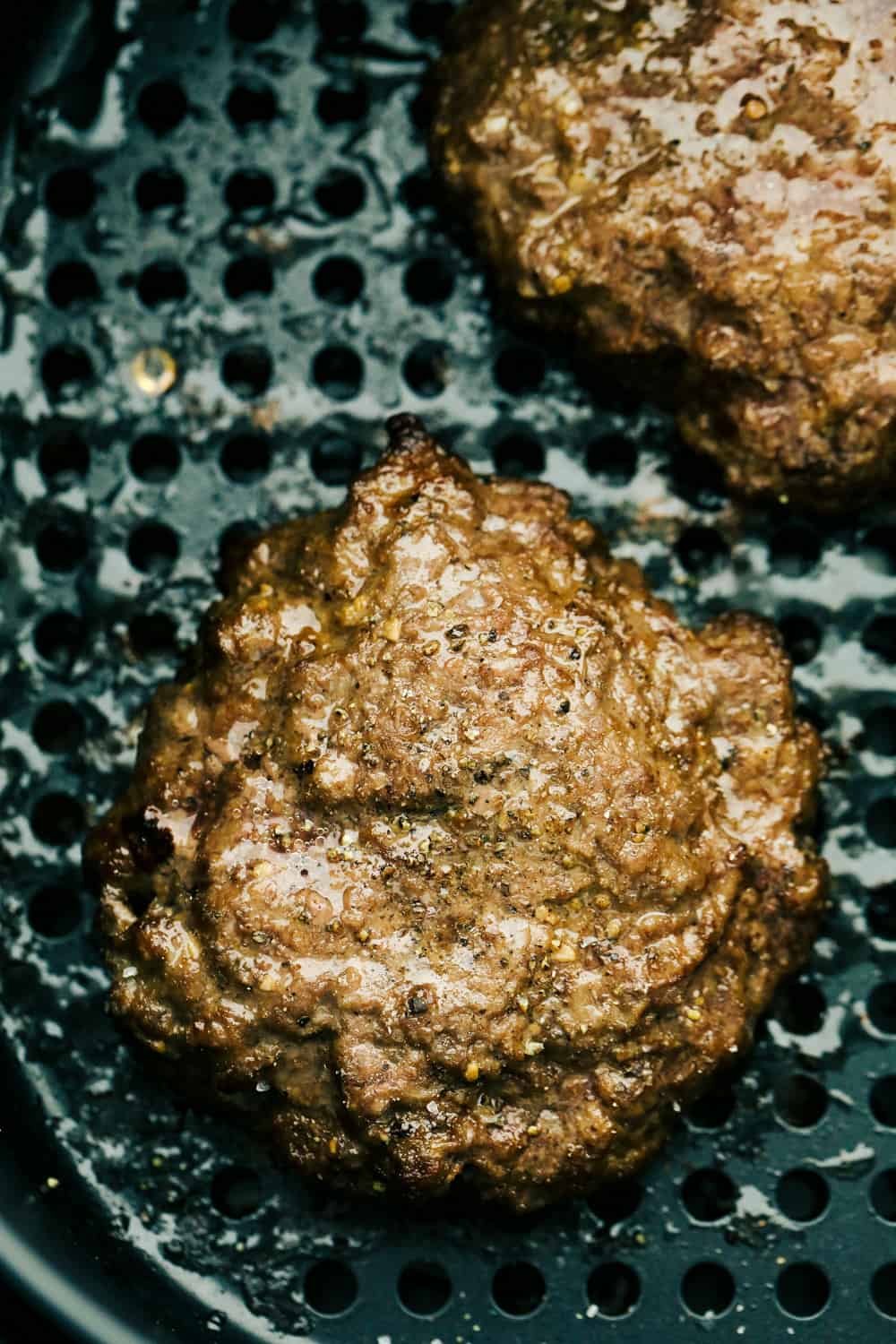 Juicy Air Fryer Hamburgers are the best burgers you will ever have, hands down! These are so succulent, they just might replace your grilled burgers forever! Air fryer hamburgers in the air fryer.