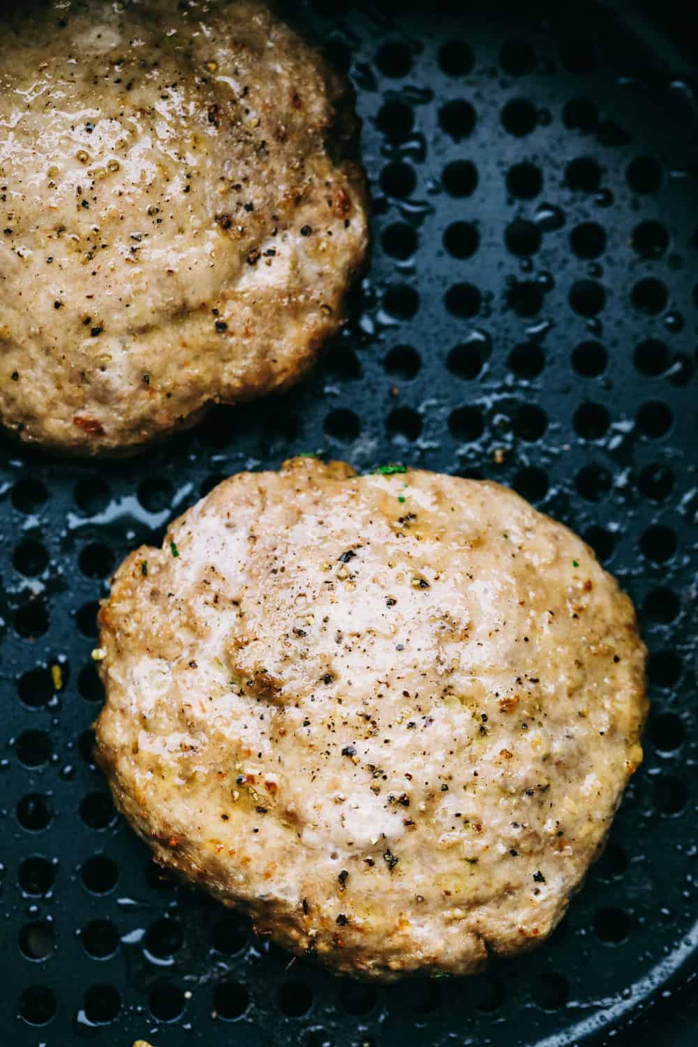 Air Fryer Turkey Burgers are the perfect answer to when you want a juicy, flavorful burger that's a bit healthier. With a seared outside and moist tender inside it's the ideal burger! Perfectly juicy air fryer turkey burgers.