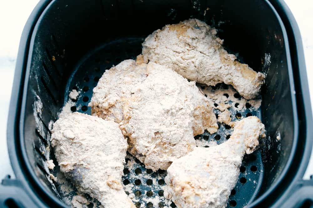 Crispy Air Fryer "Fried" Chicken is what Air Fryers were created to do! Crunchy golden seasoned outside, and tender, juicy, full of flavor inside! This is how chicken was meant to be eaten. Air fryer full of ready to cook fried chicken.