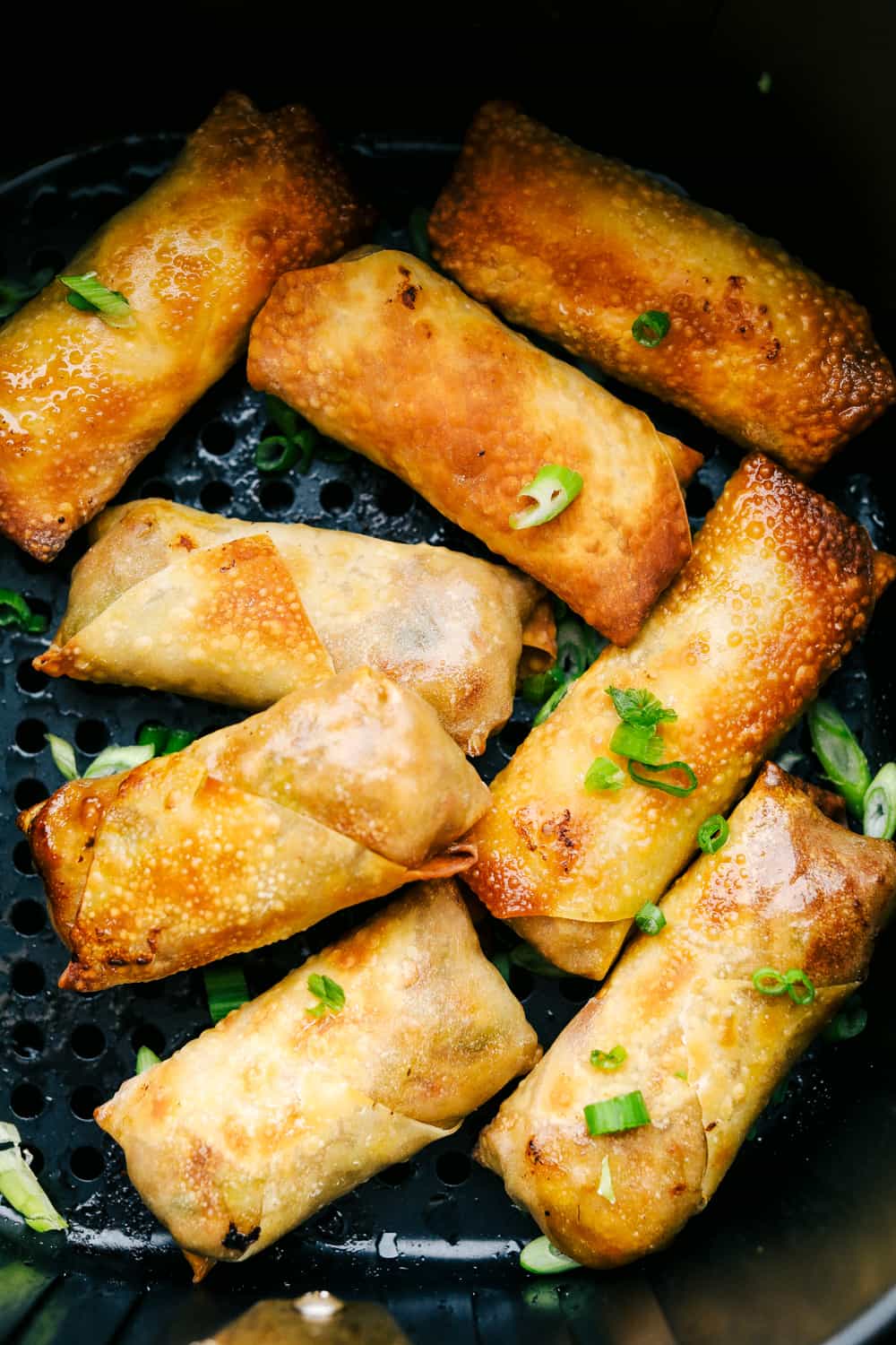 Egg Roll lovers, this Crispy Air Fryer Egg Roll Recipe is for you! Crispy, crunchy outside, tender filling inside, without the extra fat of frying or drying out from oven cooking. These are what you have been waiting for! Crispy and golden brown air fryer egg rolls.
