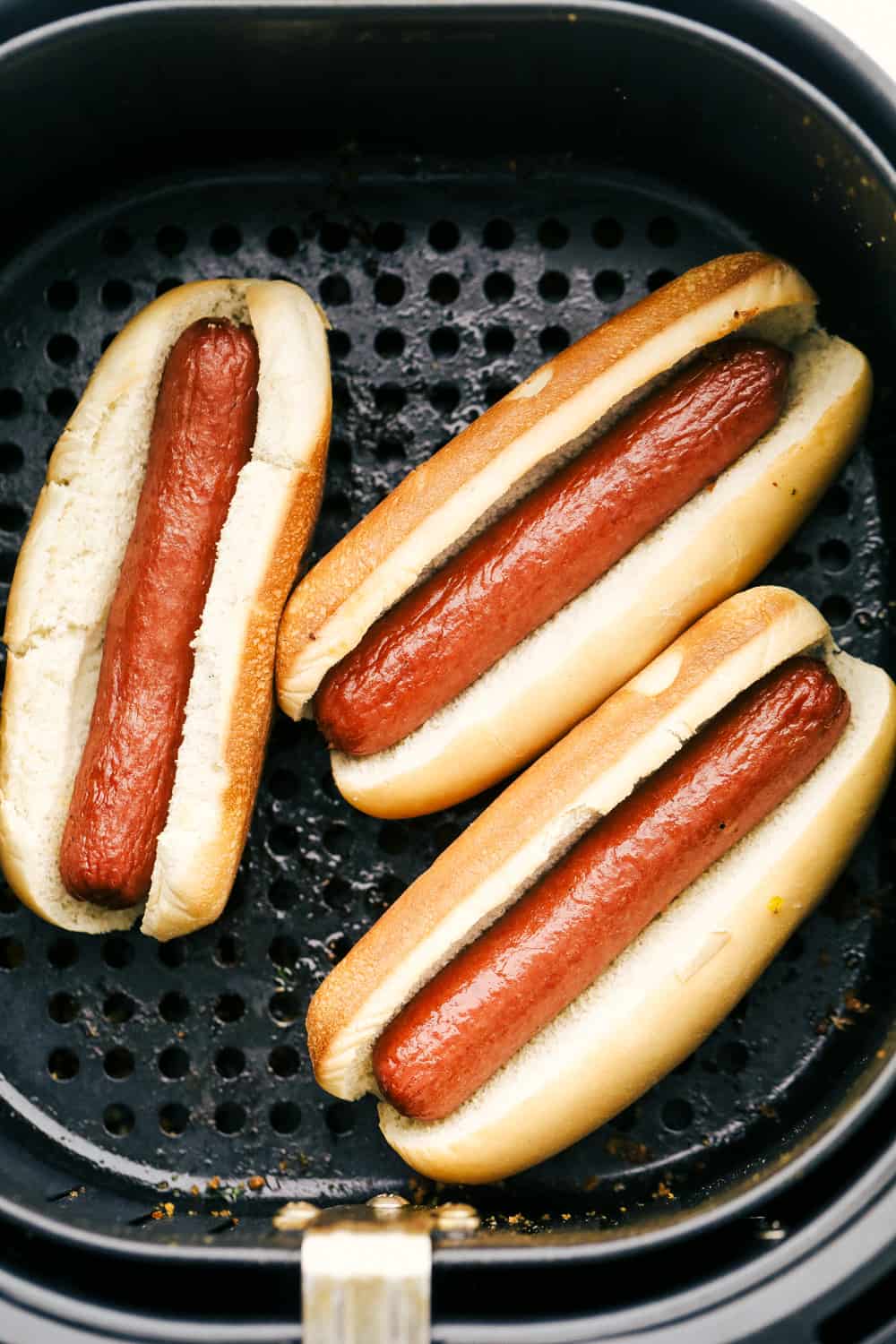 Air Fryer Hot Dogs taste better than any grilled, boiled or game-day hot dog you have ever had! Making them in the Air Fryer is a game changer! Hot dogs in buns in an air fryer.