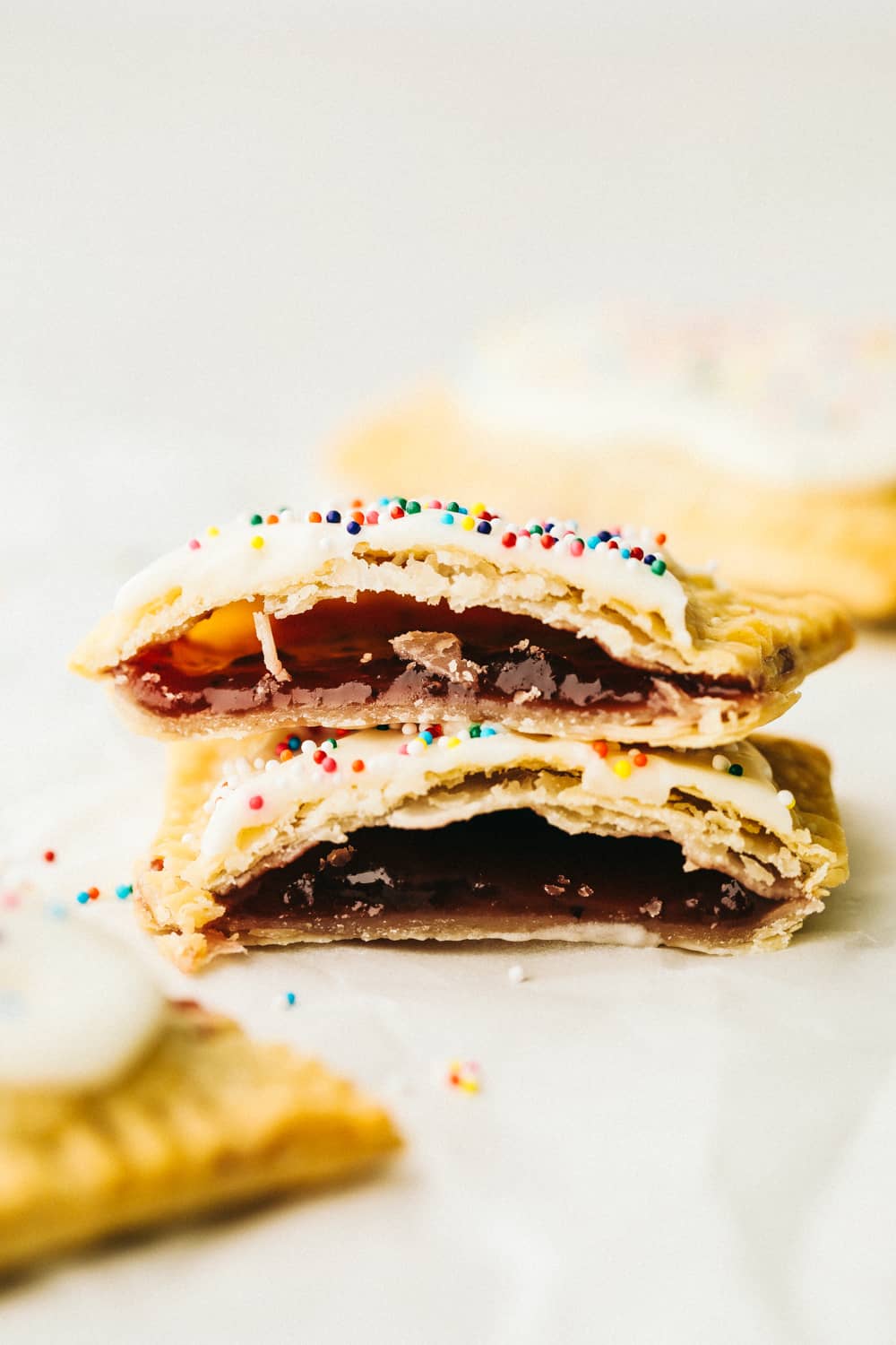 Make your kids excited to get out of bed with these Homemade Air Fryer Pop Tarts! These pop tarts have a crisp flakey crust with a tender sweet filling, and topped with frosting, of course! Flakey tender homemade air fryer pop tarts.