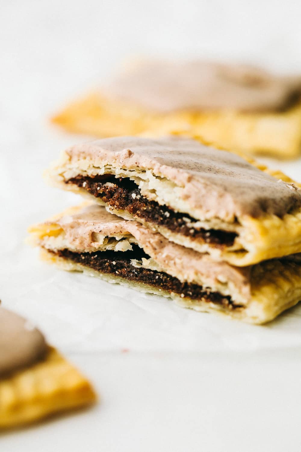 Make your kids excited to get out of bed with these Homemade Air Fryer Pop Tarts! These pop tarts have a crisp flakey crust with a tender sweet filling, and topped with frosting, of course! Frosted brown sugar pop tarts made in the air fryer.