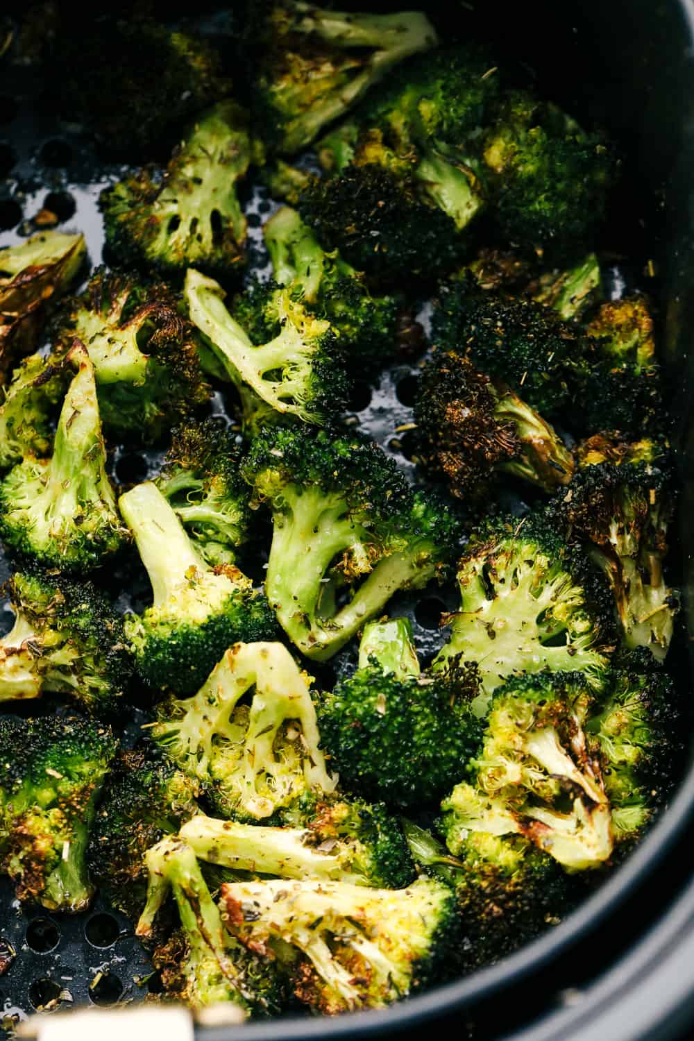 Crunchy yet tender this Air Fryer Roasted Garlic Broccoli is going to become a favorite side dish. Super quick and easy this is the best way to cook broccoli guaranteed! Air fryer "roasted" broccoli in the basket.