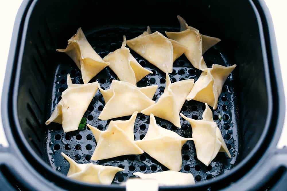 Air Fryer Cream Cheese Wontons are creamy and smooth inside and crispy golden outside. These wontons are the perfect appetizer or snack! Wontons in the air fryer ready to cook.