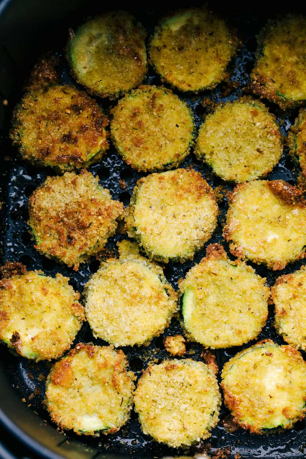 Air Fryer Parmesan Zucchini Chips are crunchy, savory bites of heaven! This is hands down one of the best ways to eat zucchini! Air Fryer Zucchini chips in the air fryer.