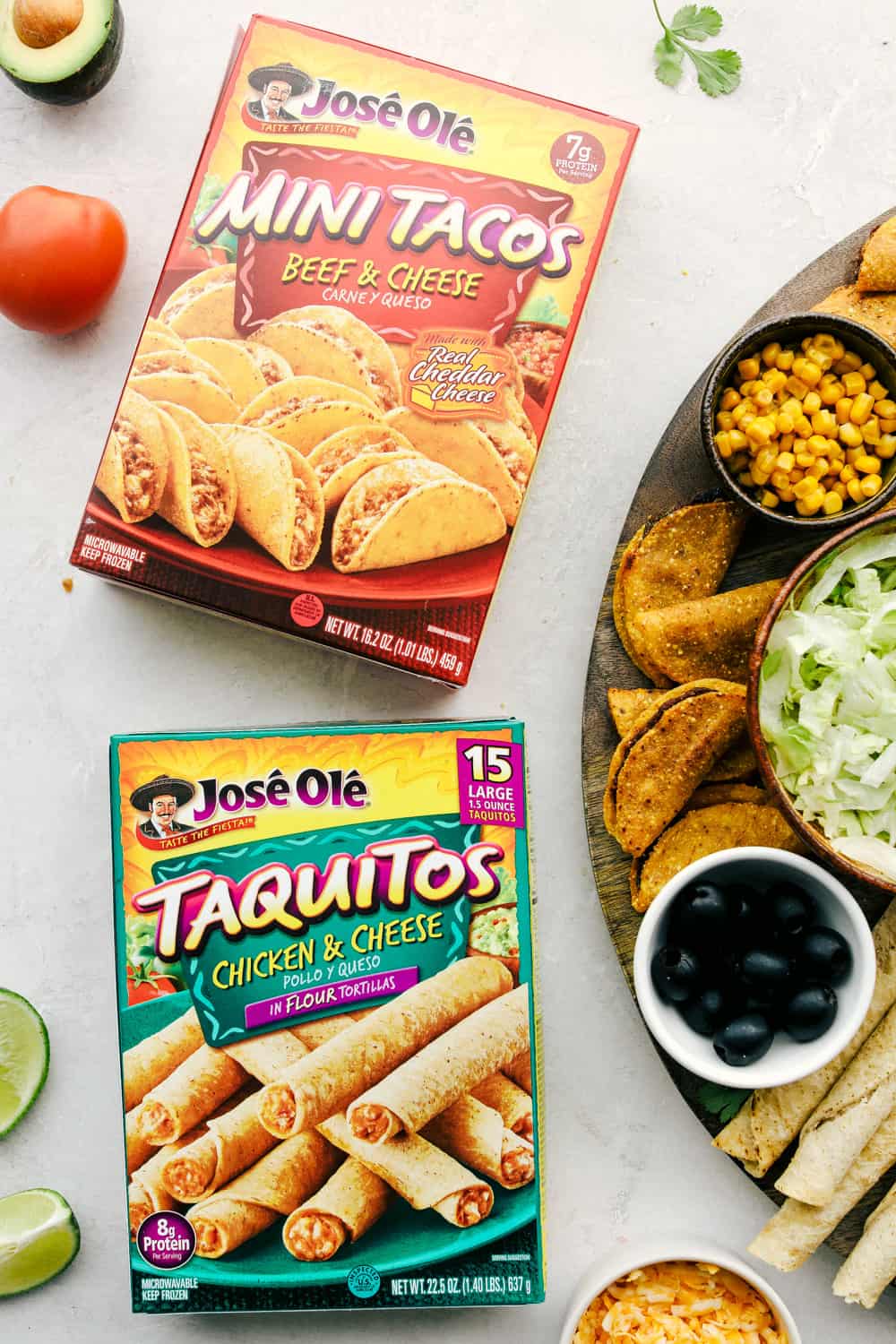 This taco board is everything you need to have for the ultimate get together! It is the perfect combination! Mini tacos and taquitos in a box with the taco board on its side.
