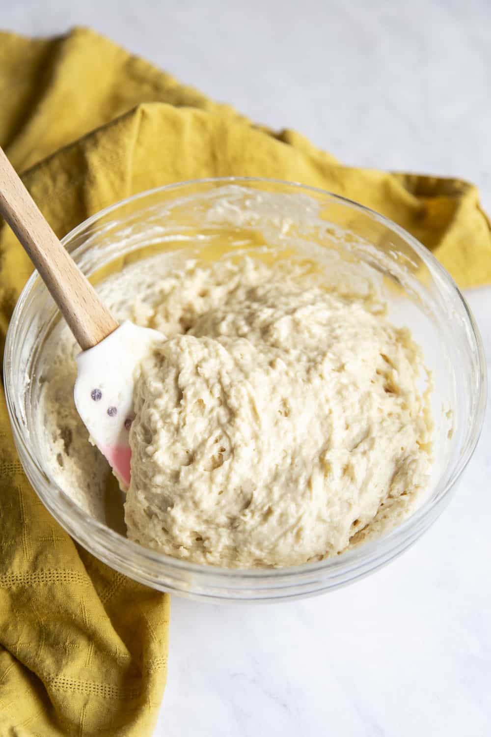 Donut Holes have to be the best part of making donuts. They are bite size and fun to eat! The donut batter in a bowl.