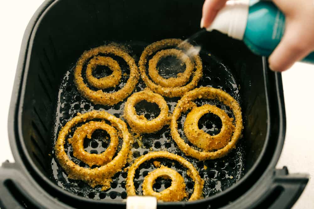 My air fryer is one of my favorite appliances in the kitchen because it can cook all my familyโs favorite recipes, including tender meats, roasted sides, crispy appetizers, and everything in between. Onion rings in an air fryer basket.