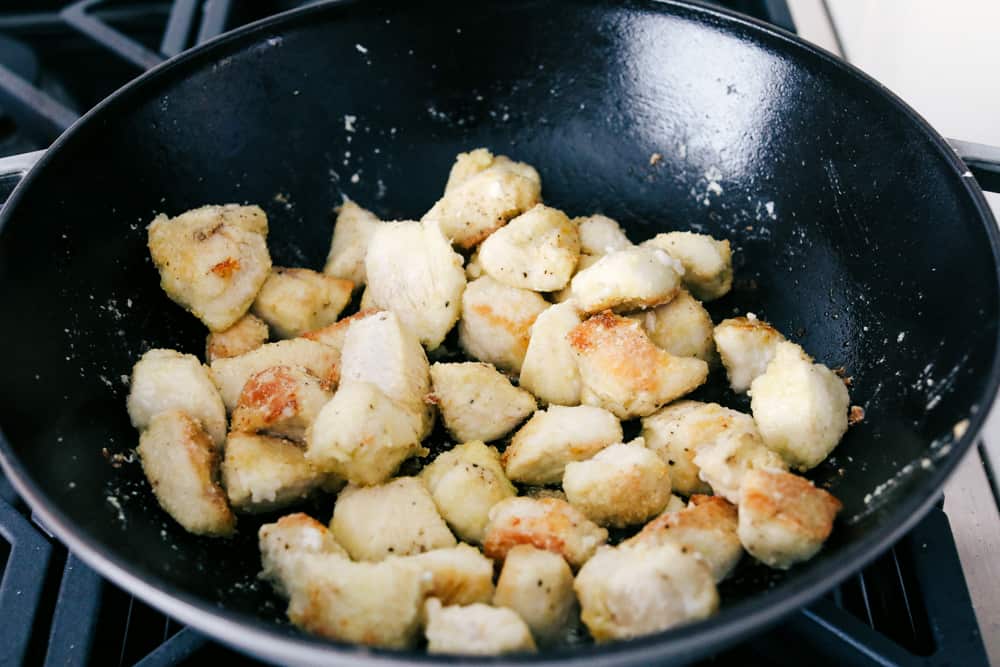 Pieces browning in a wok.