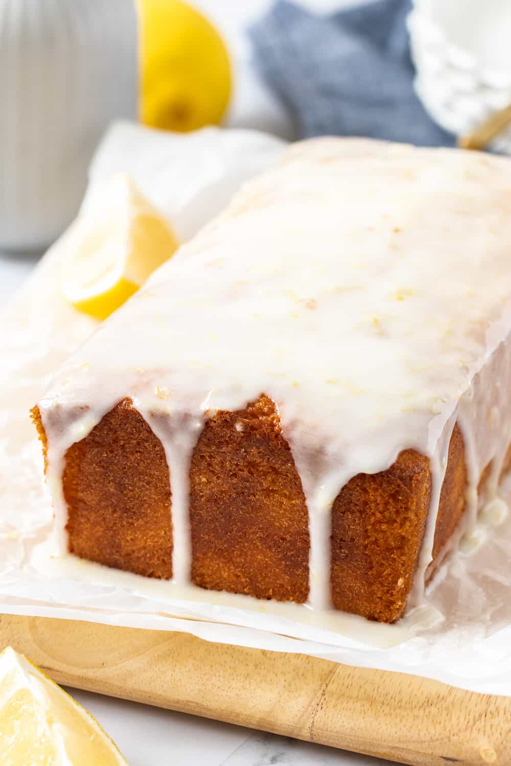 This bright and zesty glazed lemon pound cake is buttery, soft and topped with an easy lemon glaze. It is perfect for lemon lovers! A loaf cake with glaze dripping down the sides.