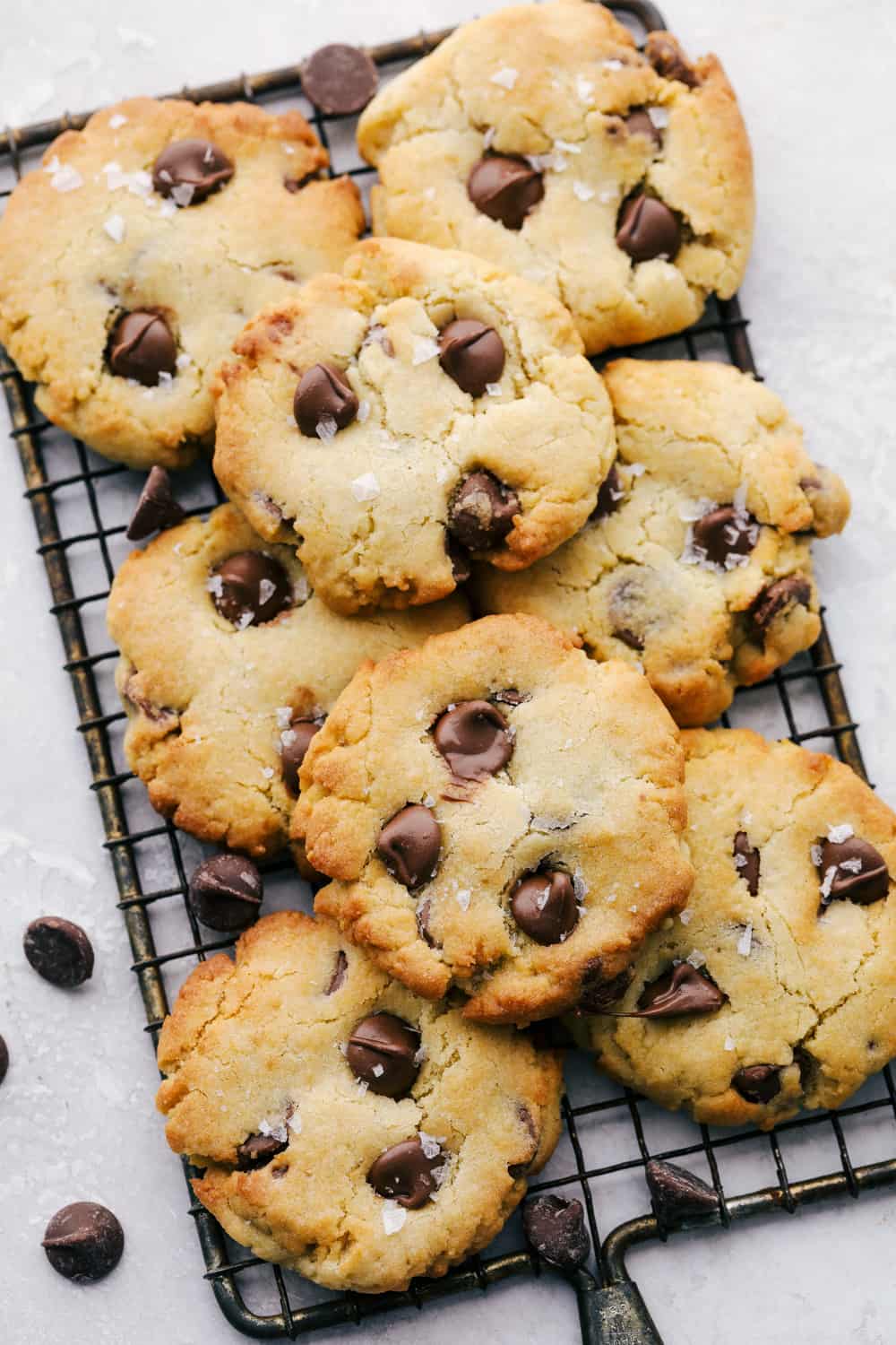 Air Fryer Chocolate Chip Cookies are crispy on the outside, ooey gooey on the inside. These cookies are going to change the way you cookie! Stacked cookies on a cooling rack.