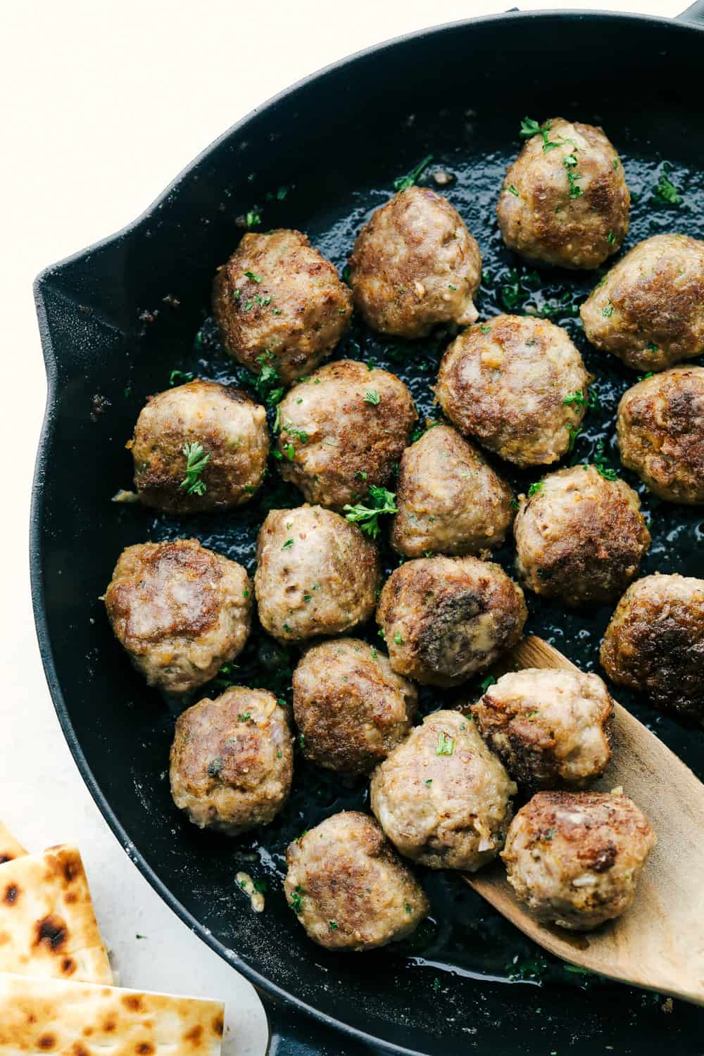 Greek Meatballs also known as Keftedes, are full of flavor and super delicious. These have all the greek flavor and super easy to make! Meatballs in the skillet browned and ready to serve.