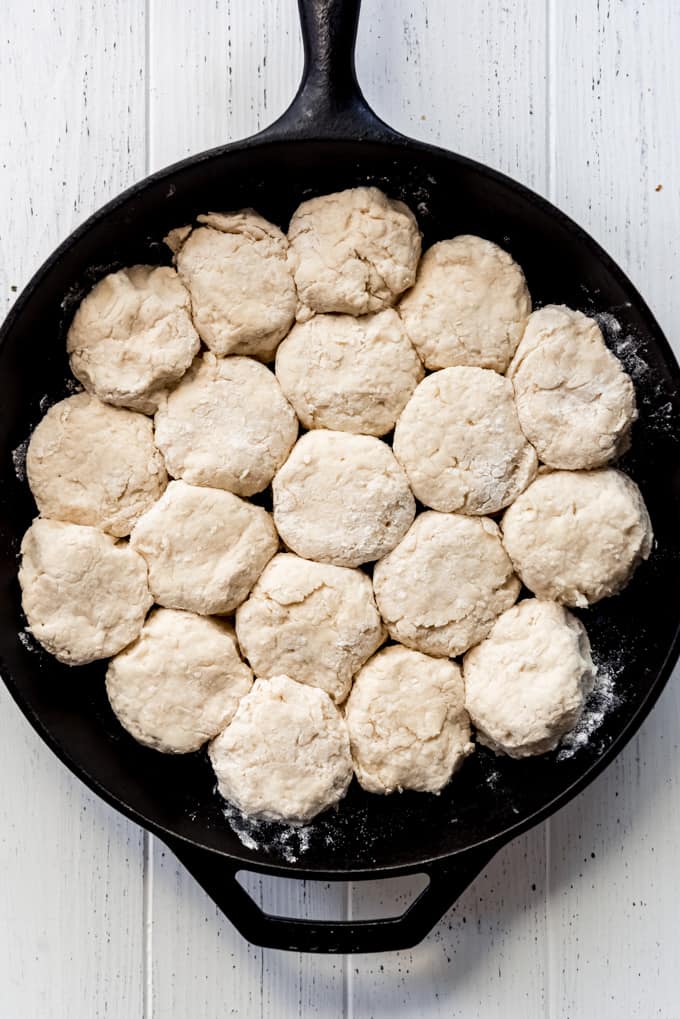 Angel Biscuits are a heavenly addition to any dinner table! These light and fluffy southern biscuits are quick and easy to throw together and they freeze great if you want to make them ahead! biscuit dough in a cast iron skillet