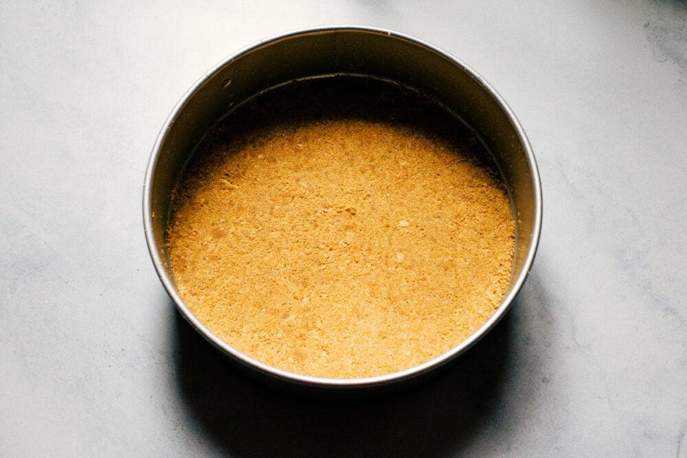 New York Cheesecake is a smooth, creamy dessert that is decant and always a favorite! This is an easy cheesecake that anyone can make. The crust in the pan.