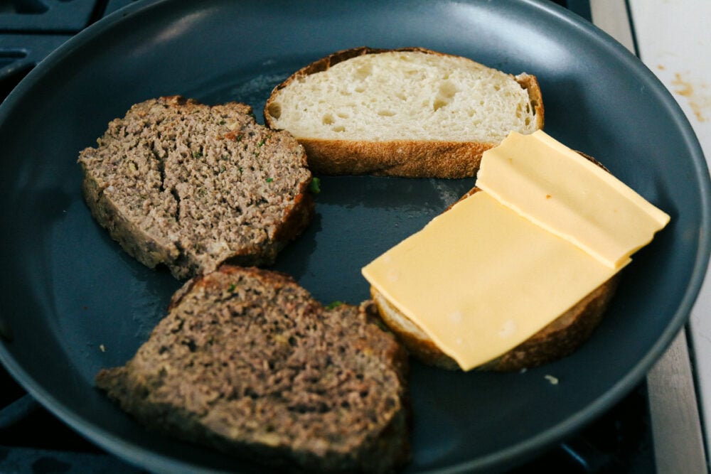 Meatloaf Sandwiches are the best combination meals with all your favorite toppings! They are juicy, full of flavor and perfect for lunch or dinner! Grilling the meatloaf, and bread topped with cheese.