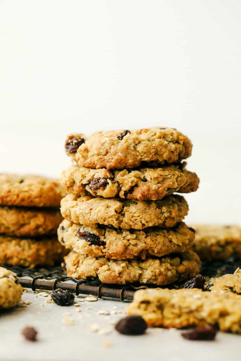 These are the Best Oatmeal Raisin Cookies you will ever make! These cookies are chewy, sweet and the perfect treat. A stack of oatmeal cookies ready to eat.