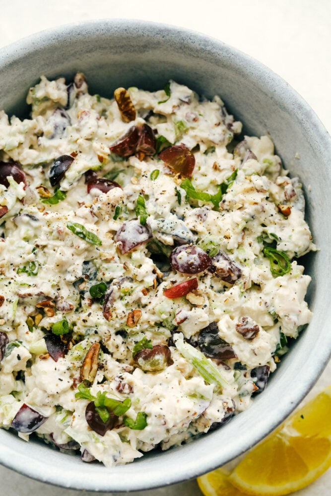 This is the Best Chicken Salad EVER! Perfect for summer picnics, festive lunches and anytime in between! The chicken salad in a bowl.