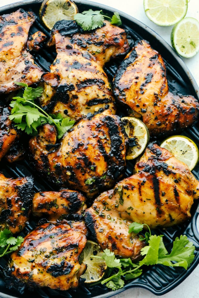 This grilled honey lime cilantro chicken is made for summer nights. It’s fresh, a little sweet, a little tangy, and packed with flavor. I make this on repeat when I need something easy that still feels like a real dinner. A plate of grilled honey lime cilantro chicken garnished with cilantro and limes.