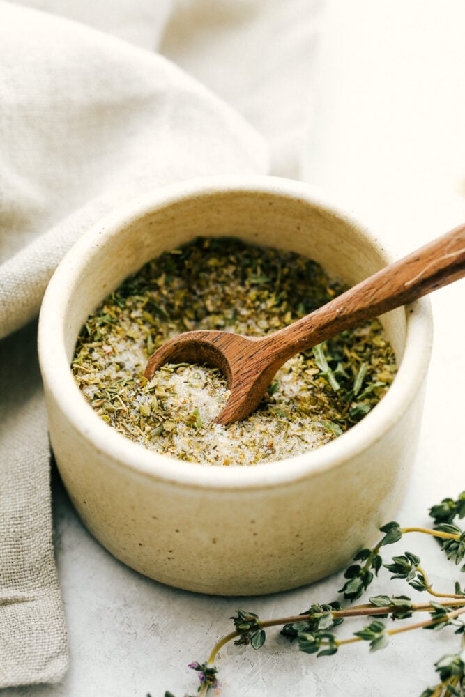 Italian Dressing Mix is super easy and way better than store bought! Full of flavor with ingredients you have right in the pantry. Italian dressing mix in a bowl with a tiny spoon.