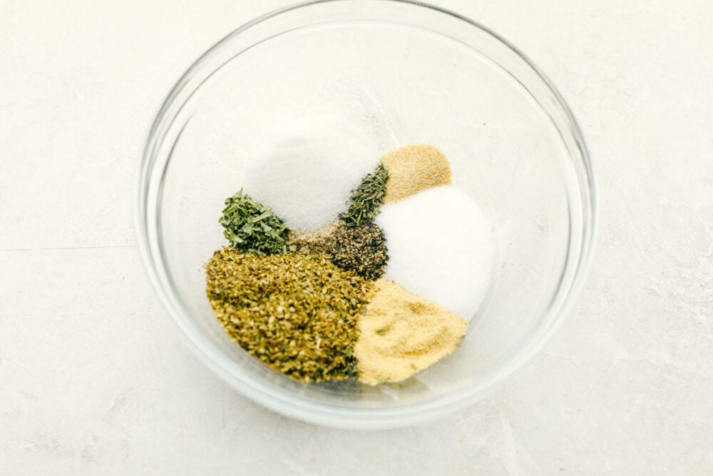 Italian Dressing Mix is super easy and way better than store bought! Full of flavor with ingredients you have right in the pantry. Seasonings separated in a glass bowl.
