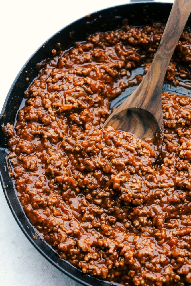 Delicious Sloppy Joes are messy, saucy and the perfect family dinner. A timeless classic, these are bound to be the best you have ever had! Finished sloppy joe mixture in a pan.
