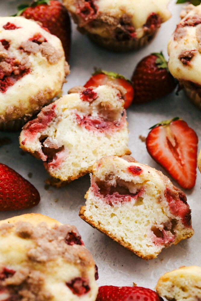 Strawberry Cheesecake Streusel Muffins are going to get you out of bed in the morning! These strawberry muffins are tender and sweet and full of flavor! Strawberry streusel muffins cut in half.