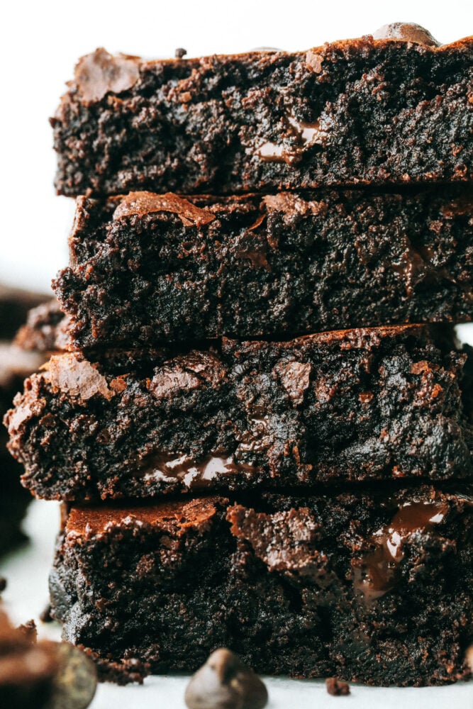 These are truly the Most Perfect Brownies Ever! These are rich, decadent and full of soul satisfying chocolate! Close up of fudgy chocolate brownies cut into squares and stacked.