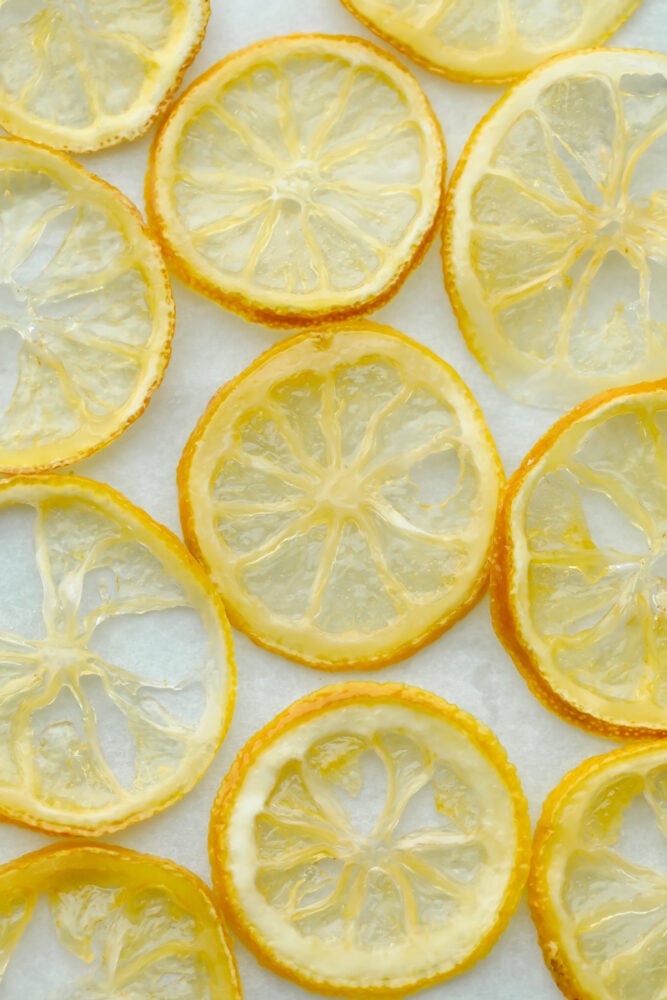 Candied Lemon Slices are super easy and a delicious way to decorate your favorite lemon foods. These lemon slices are so good you may just eat them before they get a chance to be a decoration! Dried candied lemon slices.