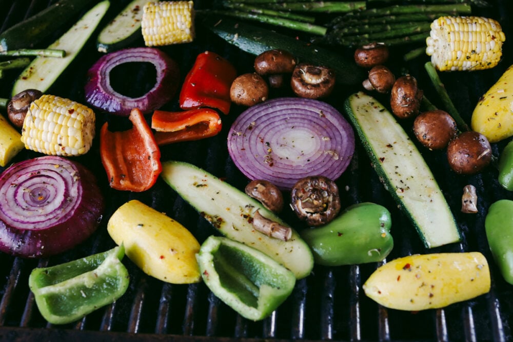 These delicious Grilled Vegetables are the perfect side to enhance any meal. They are drizzled with a savory garlic marinade that amplifies each vegetable's amazing flavor and texture! Marinated vegetables on grill.