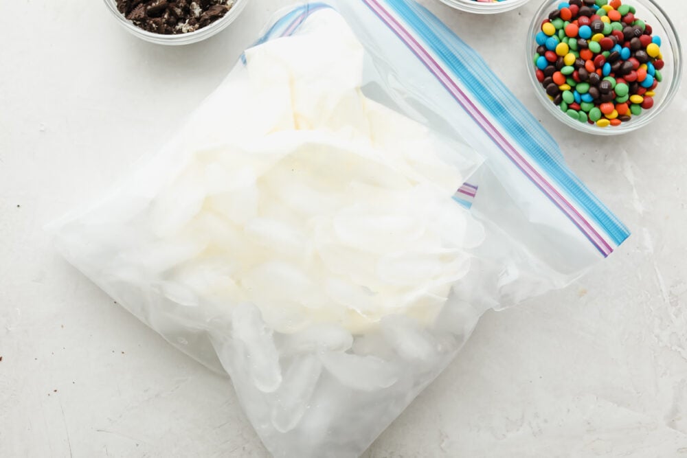 Ice cream in a bag is the perfect summer time kid-friendly treat! Super simple and absolutely delicious, this science project is one your kids are going to want to keep on repeat. The ice cream mixture surrounded by the ice in a second bag.