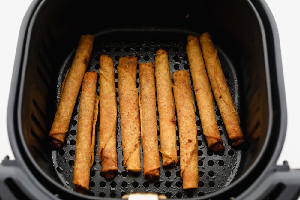 These air fryer frozen taquitos are quick and easy to make for a snack, dinner or side dish! Inside each taquito is packed with protein and flavor! Frozen taquitos in the air fryer cooking.
