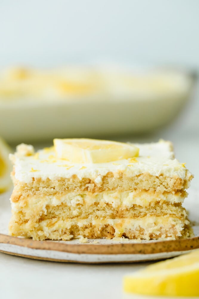 Layers of buttery shortbread and lemon cream come together in this scrumptious no-bake summer dessert! Not only is this recipe beyond easy, but has the perfect balance of tart and sweet flavors! Slice of Lemon Ice Box Cake