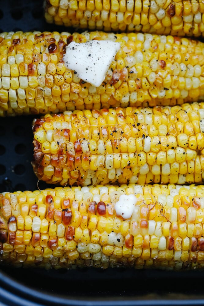 Air Fryer Corn on the Cob is going to change the way you cook corn. Super fast, tender, and full of flavor air fryer corn is insanely delicious. Air fried corn on the cob with butter.