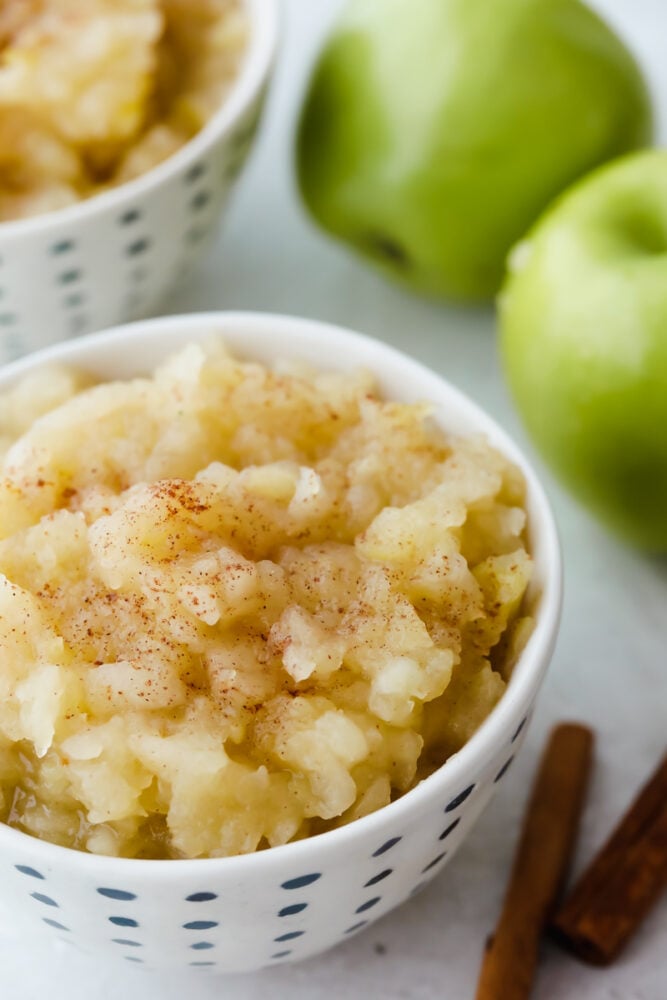 I love homemade applesauce! It is such a simple way to incorporate all of the apples that I have in my fridge! PLUS as a bonus, my kids are more inclined to eat something so simple! Applesauce in a bowl topped with cinnamon.