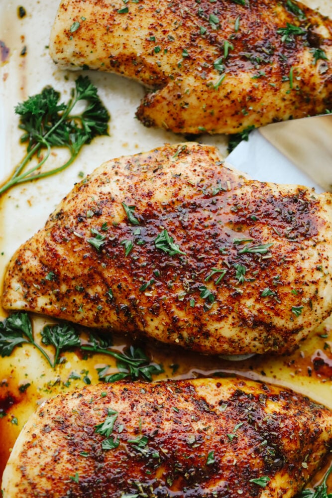 This perfect and juicy baked chicken will be sure to get a WOW at your next family get-together! It is seasoned with a delightful array of spices and baked to perfection! Your tastebuds will thank you later!! Chicken that is cooked and ready to eat.
