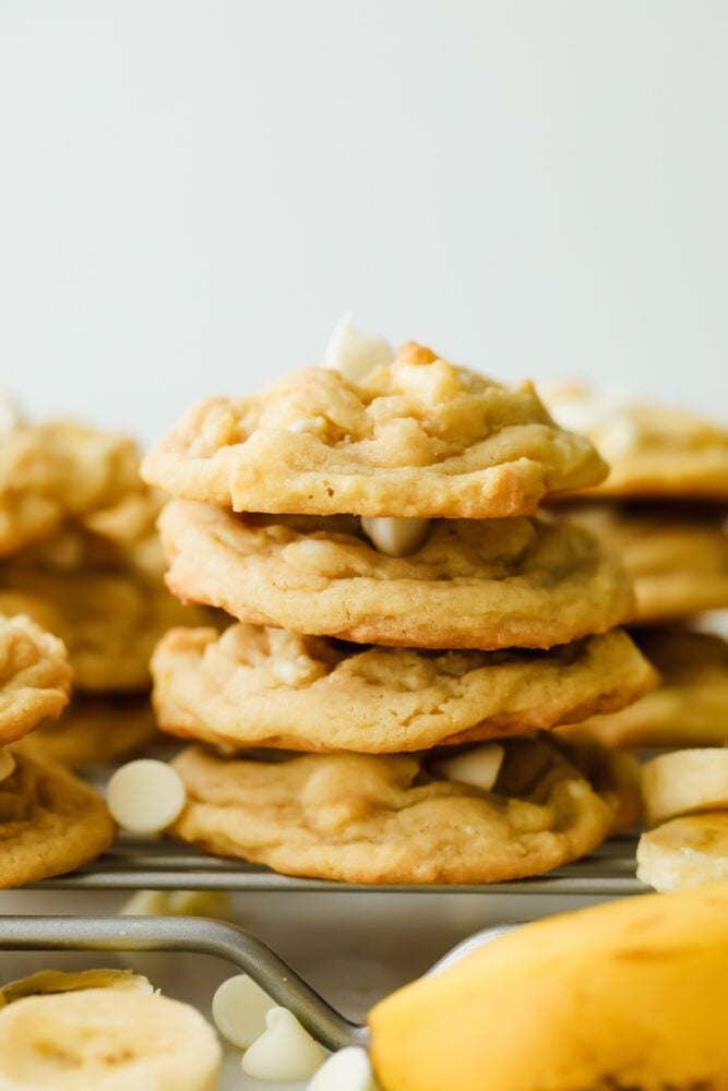 Banana Pudding Cookies are soft, chewy, and absolutely scrumptious. With all the banana flavor of a banana cream pie wrapped in a cookie. Banana pudding cookies stacked on top of each other.