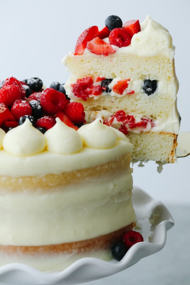 Showcase fresh summer berries with a supremely moist sponge cake and fluffy Chantilly cream! This beautiful Chantilly Berry Cake is a light, airy treat that is bound to impress! Slice of Chantilly Berry Cake.