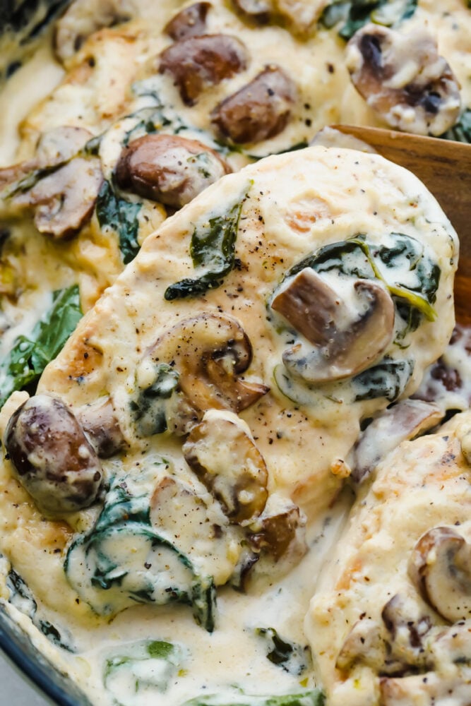Creamy Parmesan Garlic Mushroom Chicken is ready in just 30 minutes and the parmesan garlic sauce will wow the entire family! This will become a new favorite! Close up picture of the finished creamy chicken dish.