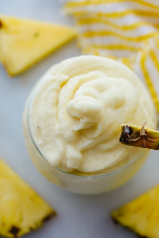 Dole Pineapple Whips are the perfect summertime treat that you can make at home. Similar to Disneyland's and Hawaii's Dole whips, they are refreshing and quick. Creamy texture of a pineapple whip up close.